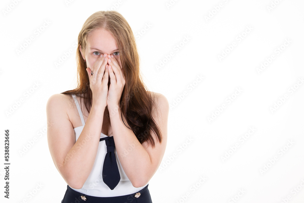 woman peeks though fingers covers face woman with both hands in portrait frightened expression as notices something terrible scaring on copy space white background woman peeks though fingers covers face woman with both hands in portrait frightened expression as notices something terrible scaring on copy space white background