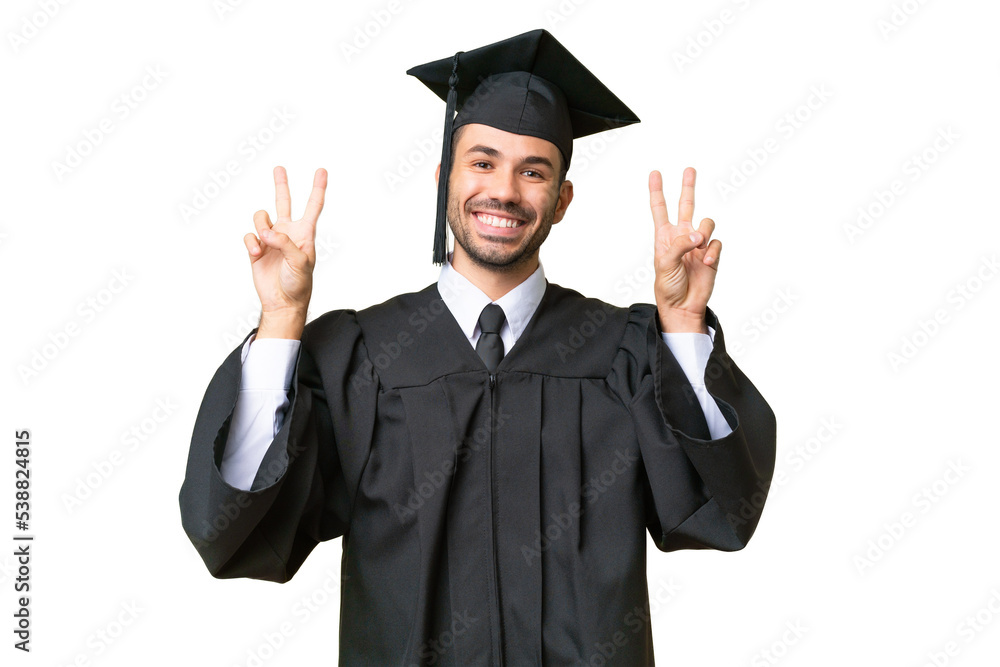 Young university graduate man over isolated background showing victory sign with both hands Young university graduate man over isolated background showing victory sign with both hands