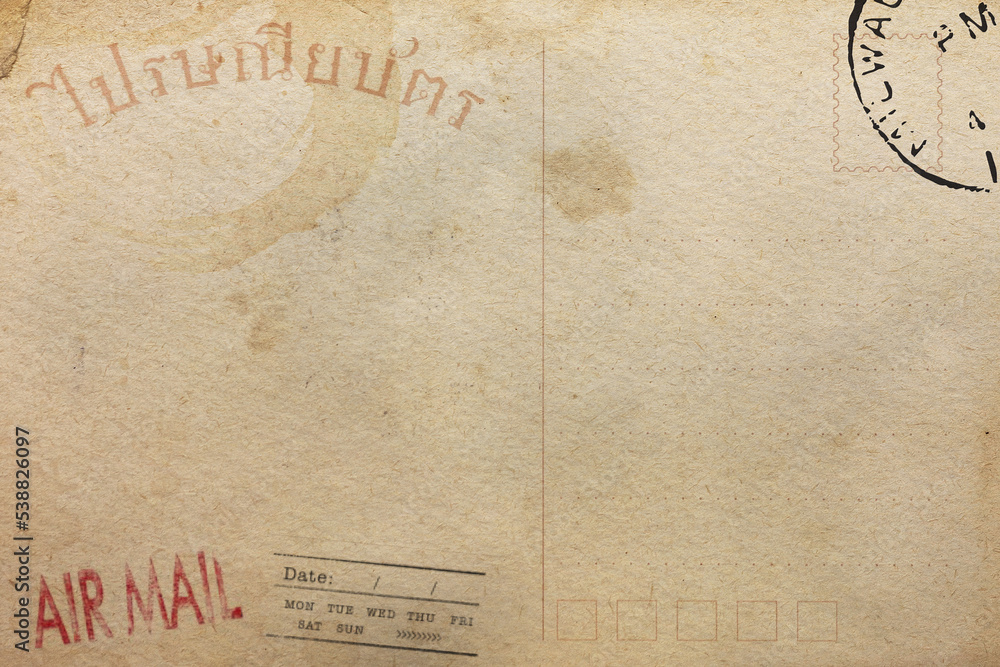 Backside of old postcard in Thai language with dirty stain