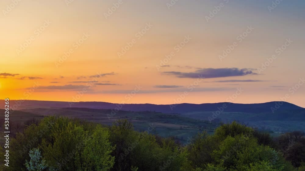 Field with plants in the valley against the backdrop of the sunset sky in Bulgaria Field with plants in the valley against the backdrop of the sunset sky in Bulgaria