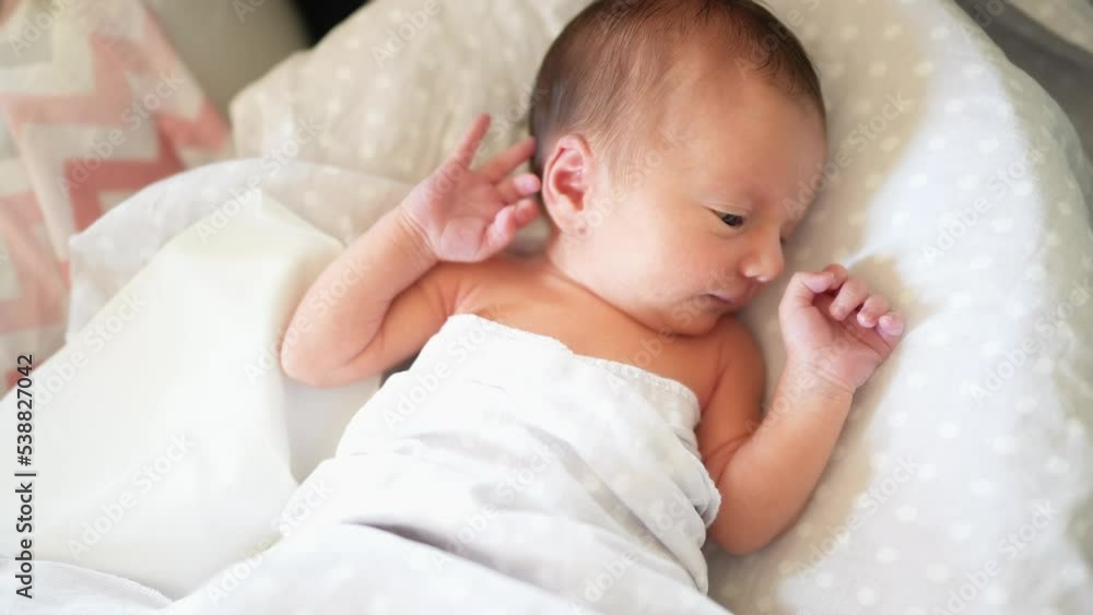 baby newborn. little baby a newborn 1 month of life lies in bed in the maternity hospital. happy family kid dream concept. close-up baby indoors. lifestyle beautiful cute girl lies at home