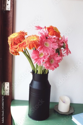 A beautiful bouquet of colorful flowers in a vase on a table