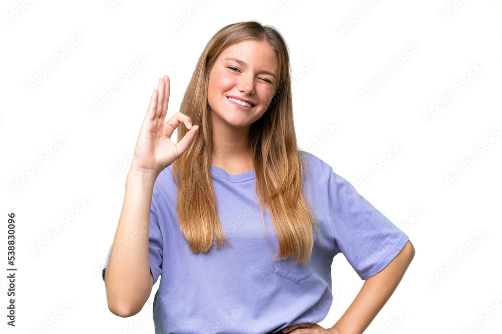 Young beautiful woman over isolated background showing ok sign with fingers Young beautiful woman over isolated background showing ok sign with fingers