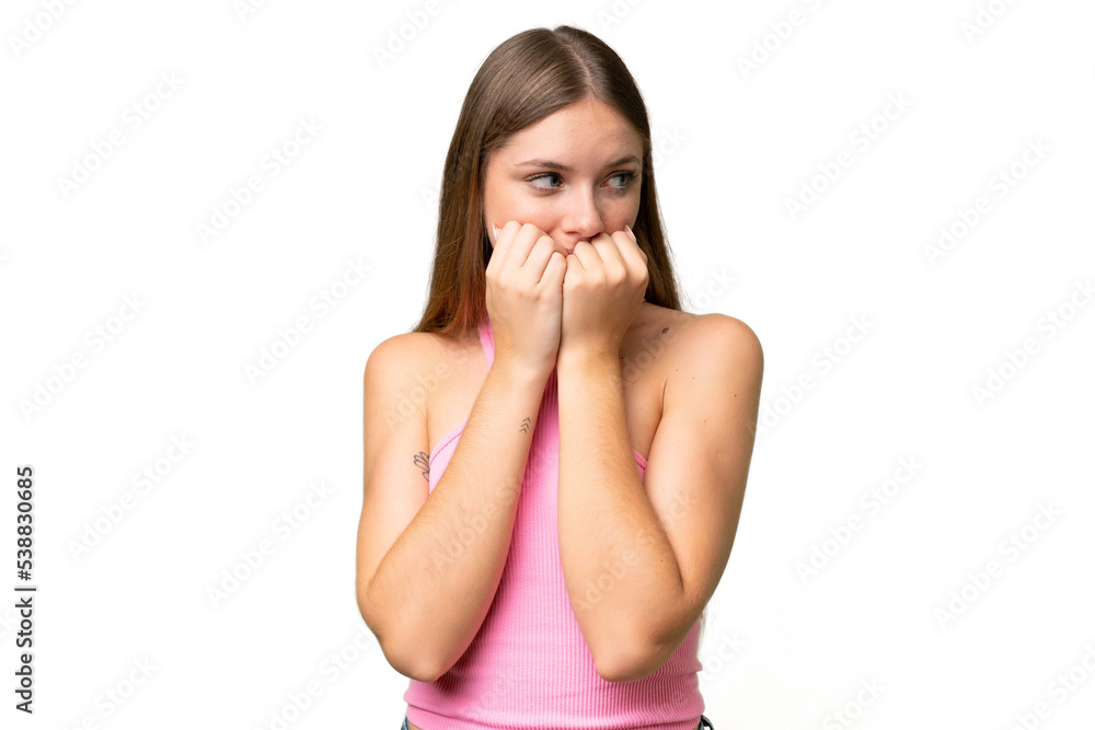 Young beautiful blonde woman over isolated background nervous and scared putting hands to mouth Young beautiful blonde woman over isolated background nervous and scared putting hands to mouth