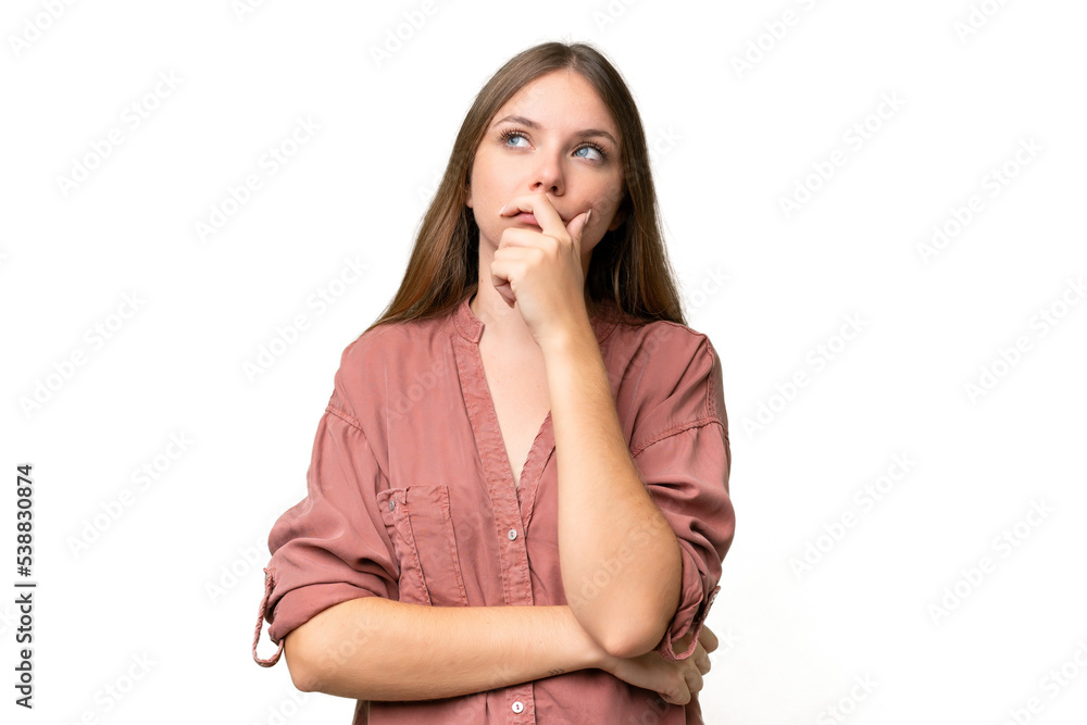 Young beautiful blonde woman over isolated background having doubts and with confuse face expression - obrazy, fototapety, plakaty 