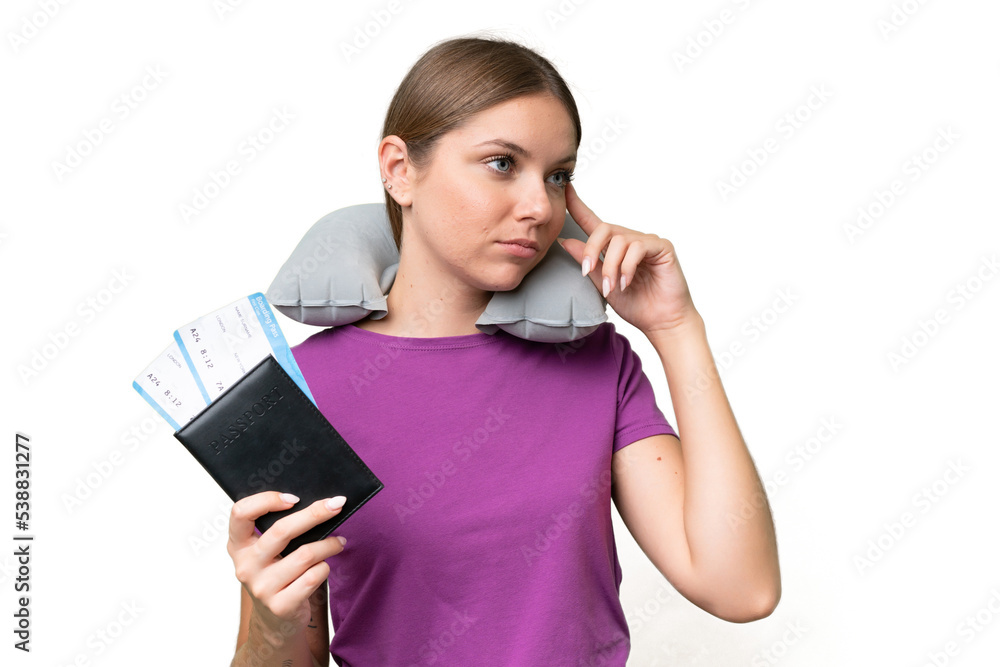 Young beautiful blonde woman with Inflatable travel Pillow over isolated background having doubts and thinking Young beautiful blonde woman with Inflatable travel Pillow over isolated background having doubts and thinking