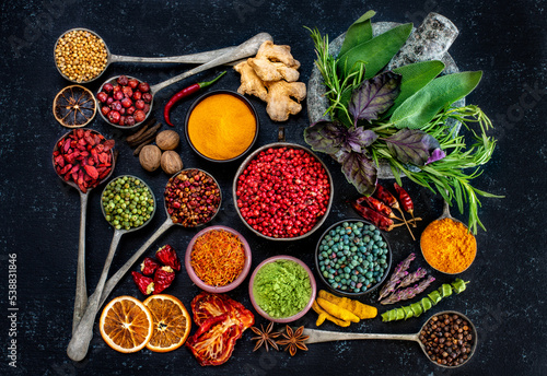 Various spices and dried fruits on the table.