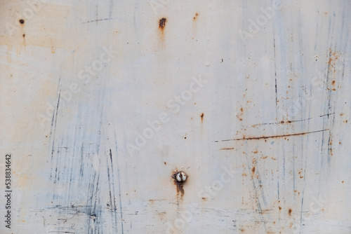 Grungy scratched metal painted background with abstract texture
