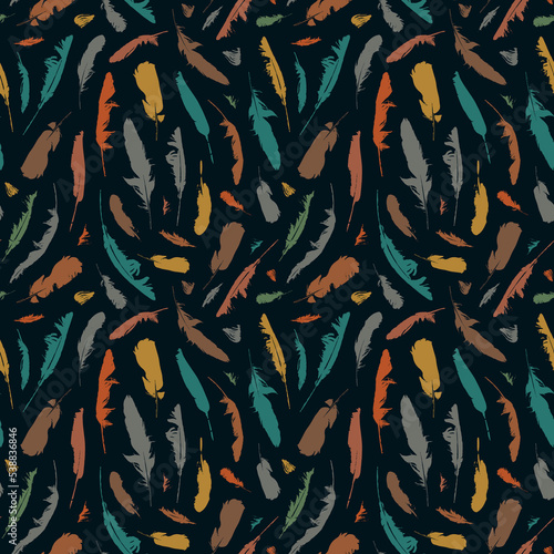 Seamless pattern with colored disheveled feathers on a black backdrop in boho style. Repeating vector background with randomly scattered bird feathers. Suitable for wallpaper, wrapping paper, fabric