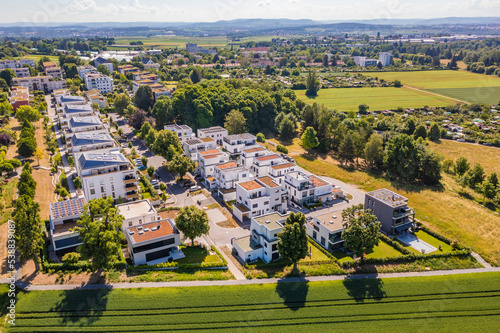 Germany, Baden-Wurttemberg, Ludwigsburg, Aerial view of rural suburb with modern energy efficient houses photo