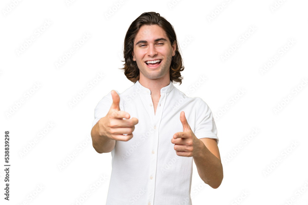 Young caucasian man isolated on green chroma background pointing to the front and smiling Young caucasian man isolated on green chroma background pointing to the front and smiling