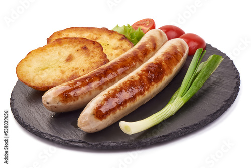 Grilled German pork sausages, Thuringer Rostbratwurst, close-up, isolated on white background.