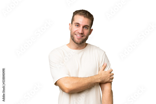 Young handsome caucasian man isolated on green chroma background laughing