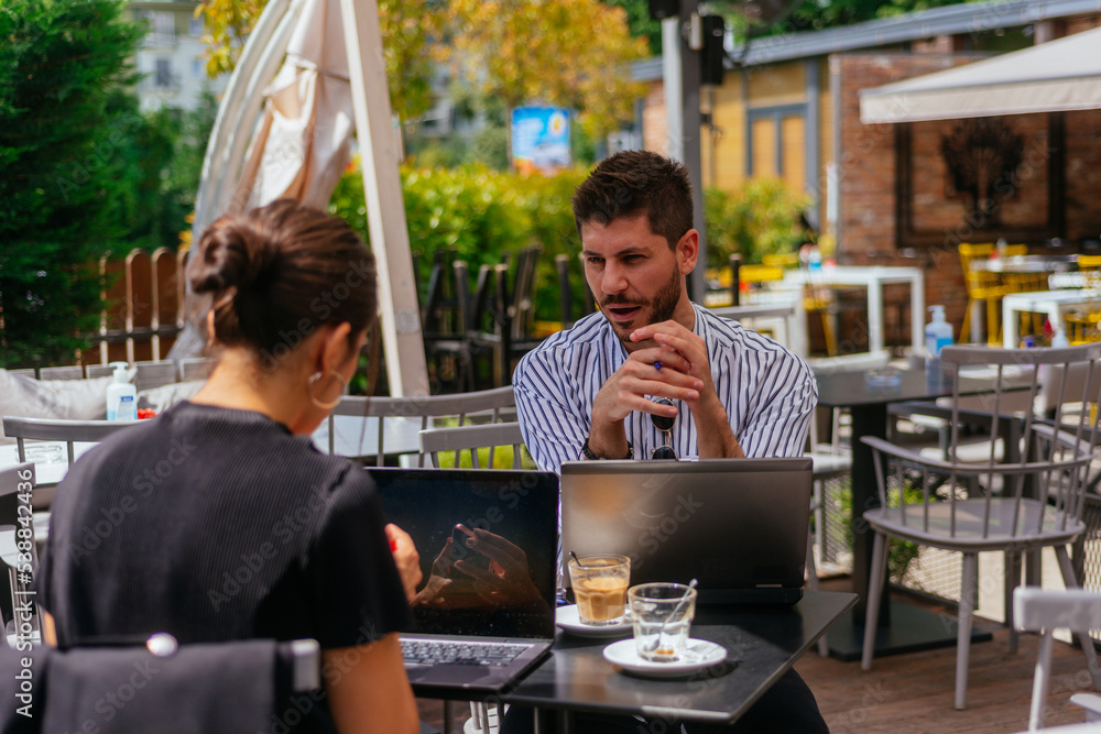 Business couple in a coffee bar