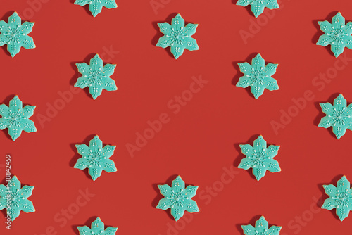 Wallpaper Mural Creative Christmas pattern made of snowflake shaped.cookies on bold red background. New Year cozy decoration. Holiday flat lay aesthetic. Minimal visual with copy space. Torontodigital.ca