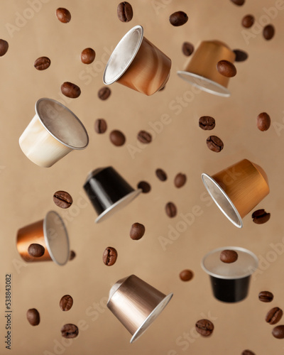 Floating coffee capsules with coffee beans photo