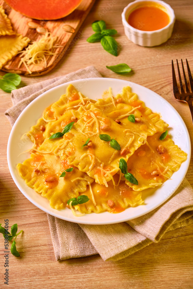 Homemade Pumpkin Ravioli with ricotta cheese served basil Homemade Pumpkin Ravioli with ricotta cheese served basil