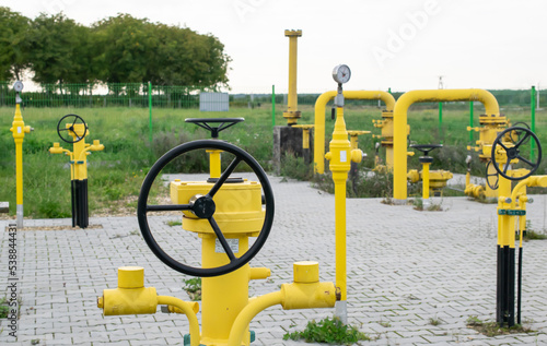 gas pipeline, natural gas installation, yellow pipes and valves, high gas prices