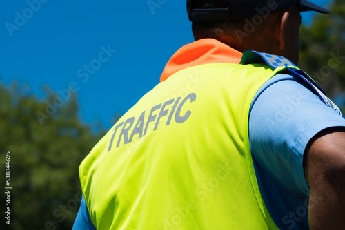 traffic cop dressed in uniform with high visibility vest or jacket closeup concept road safety in South Africa photo