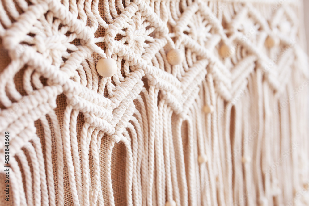 Handmade jute shopping bag with macrame decor. Eco bag for women from Jute and cotton rope. Scandinavian style shopper. Beige tones, sustainable fashion accessories. Zero waste lifestyle. Handmade jute shopping bag with macrame decor. Eco bag for women from Jute and cotton rope. Scandinavian style shopper. Beige tones, sustainable fashion accessories. Zero waste lifestyle.
