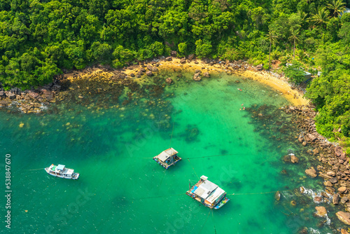 Wallpaper Mural Nice beach in Phu Quoc island Vietnam. The bay with blue water, coconut trees, and fine sand is considered a beautiful beach in the Gulf of Thailand Torontodigital.ca