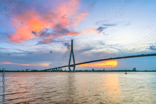 Sunset Can Tho bridge, Can Tho city, Vietnam. Cable-stayed bridge connecting road traffic in Vinh Long and Can Tho provinces for trade and commerce in the Mekong Delta