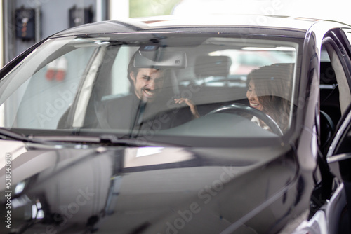 Young couple buying a car stock photo