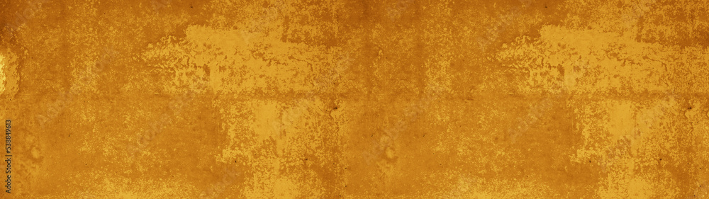 Abstract grunge spotted old aged retro antique yellow orange colored stone concrete paper texture background panorama banner, long pattern backgrounds.