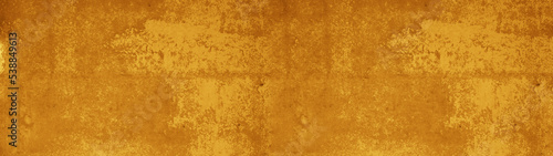 Abstract grunge spotted old aged retro antique yellow orange colored stone concrete paper texture background panorama banner  long pattern backgrounds.