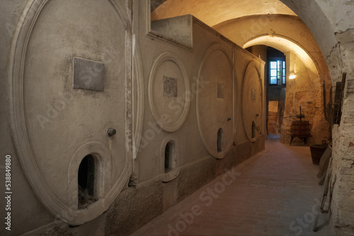 Ancient underground wine cellar with concrete container for wine fermentation