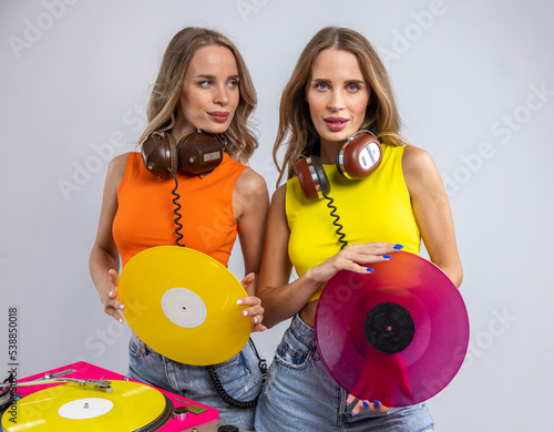 Twin female DJs with turntables