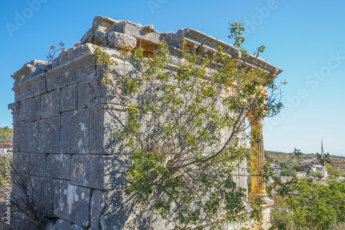 left 2nd second one demircili imbrigon cilicia mausoleum back and right shot with tree, roman empire, ion korihth, silifke mersin turkey photo