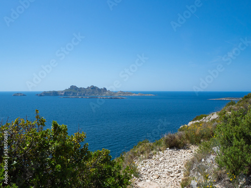 Calanques, France - May 20th 2020: Hiking high above the Mediterranean Sea along a rocky coast © Thomas