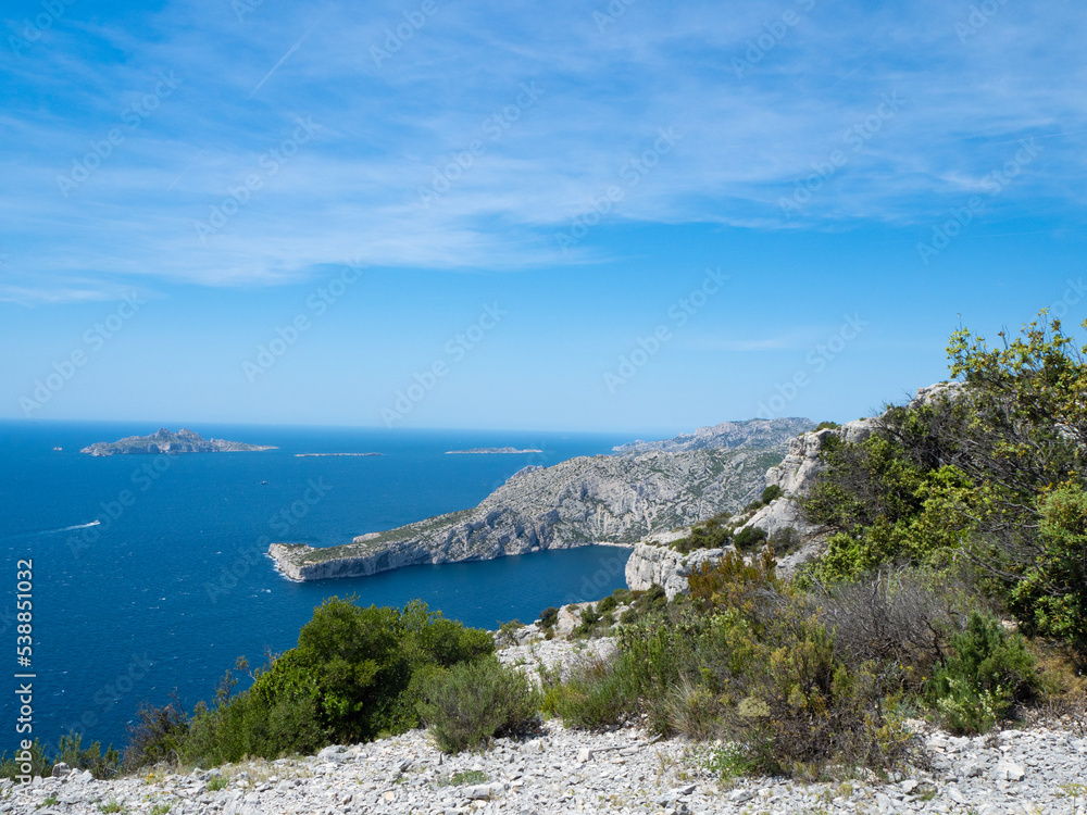 Calanques, France - May 20th 2020: Hiking high above the Mediterranean Sea along a rocky coast
