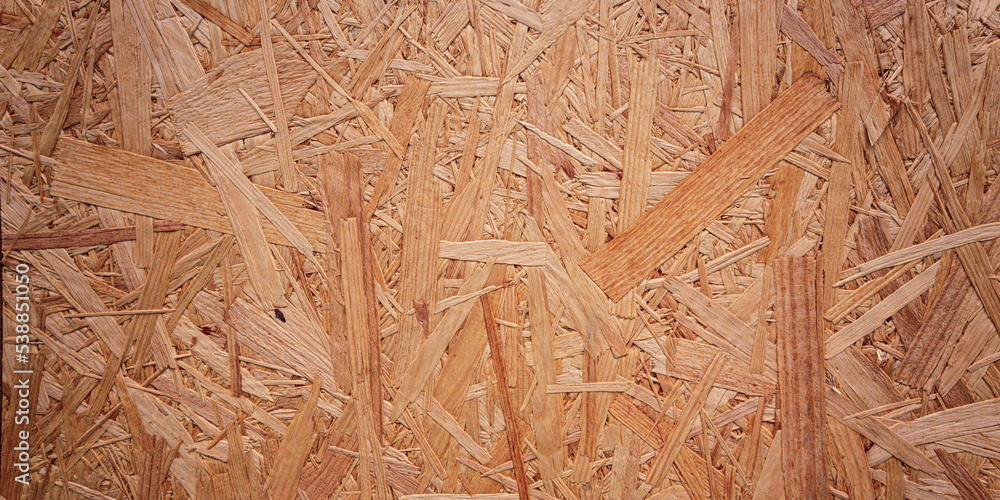 closeup of the surface of a oriented strand board/OSB as a detailed view on the material closeup of the surface of a oriented strand board/OSB as a detailed view on the material