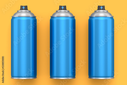 Set of spray paint cans on yellow background. Spray bottle and dispenser