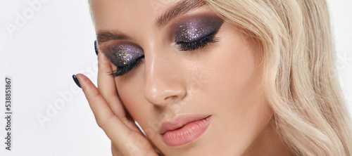 Closeup shot of woman eye with evening makeup. Long eyelashes. Smokey Eyes. Banner