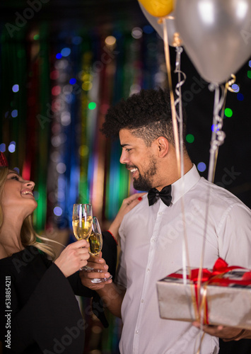 Office colegues celebrating new years eve
Drinking champagne 
feeling festive photo