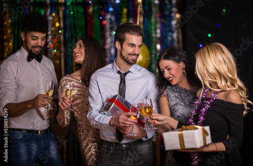 Office colegues celebrating new years eve
Drinking champagne 
feeling festive photo