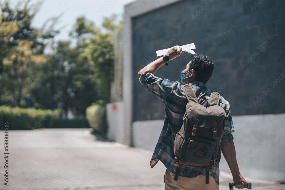 Tourists drag their luggage to check in at the hotel they reserved. Travel concept.. Tourists drag their luggage to check in at the hotel they reserved. Travel concept..