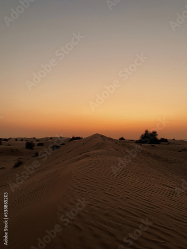 Beautiful sunset above desert dunes