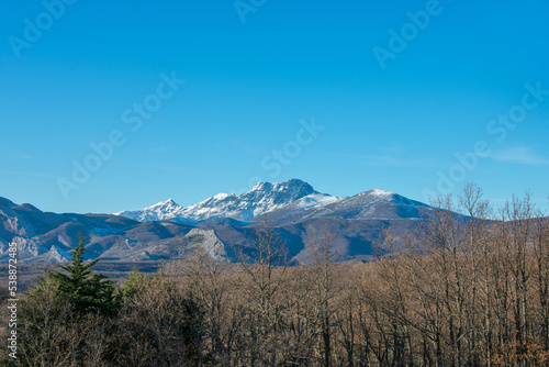 snow capped mountains with blue sky © photointruder