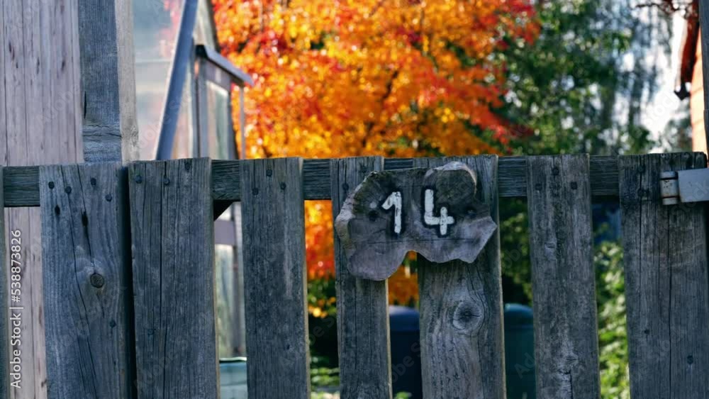 Number fourteen painted on rickety wooden fence Number fourteen painted on rickety wooden fence