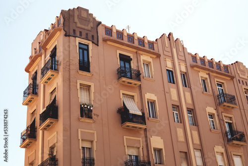 Architecture of a red house against a blue sky photo