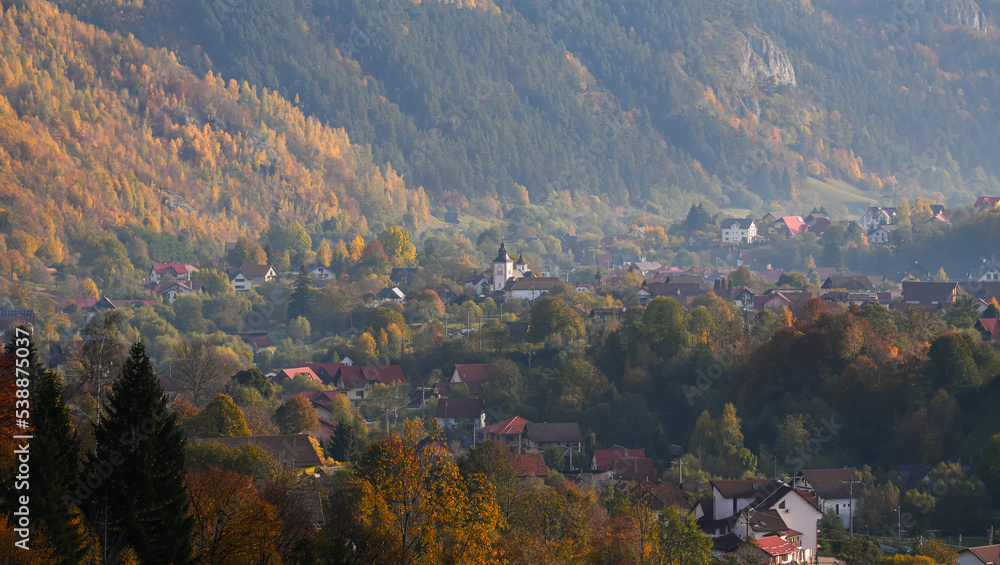 Bran village in autumn landscape. Aerial view with this beautiful village from Transylvania photographed during a fall morning.