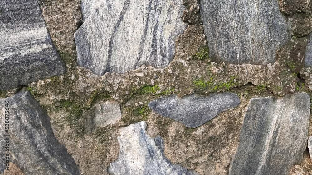 Stone walls. This wall is made of cement sand and stone. It is stronger than a brick wall. A stone wall of multicolored layered natural stone. Rocks wall. Background video.
Stone walls. This wall is made of cement sand and stone. It is stronger than a brick wall. A stone wall of multicolored layered natural stone. Rocks wall. Background video.