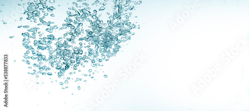 Crystal clear water drops with banner copy space on white