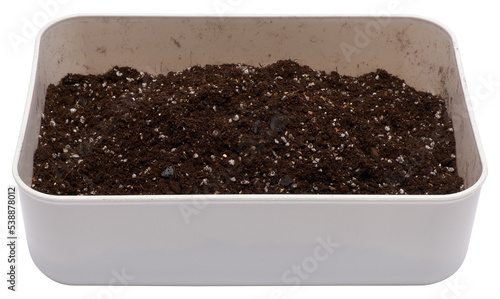 plastic box with substrate soil for transplanting houseplants isolated