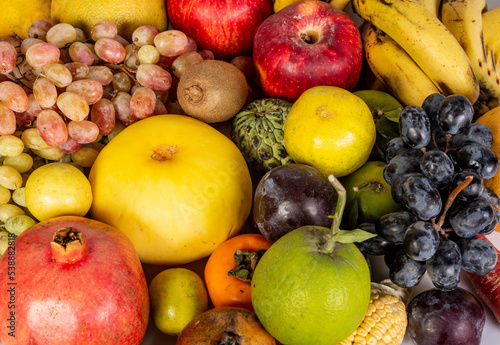 Closeup of fresh and healthy fruits on wallpaper design - health lifestyle concept