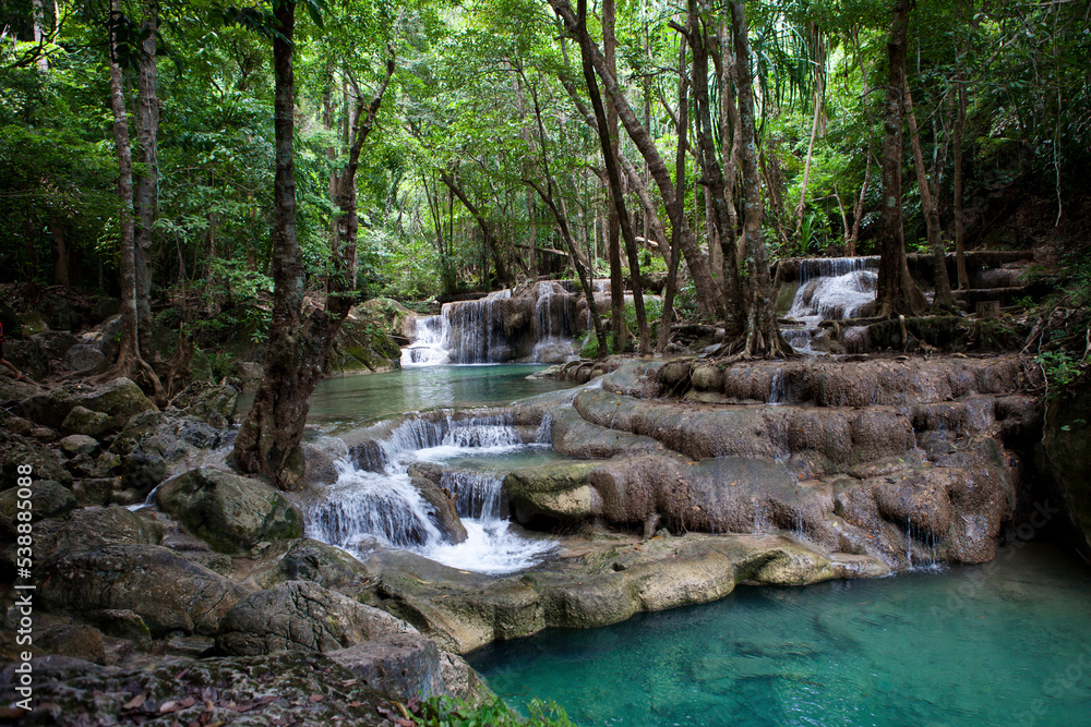Fototapeta premium Erawan Waterfall in Kanchanaburi. Amazing turquoise water and wonderful jungle. Ideal place for a picnic and relaxation. One of the most famous tourist attractions in Kanchanaburi province, Thailand. 